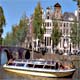 Battello sotto i ponti dell'Herengracht